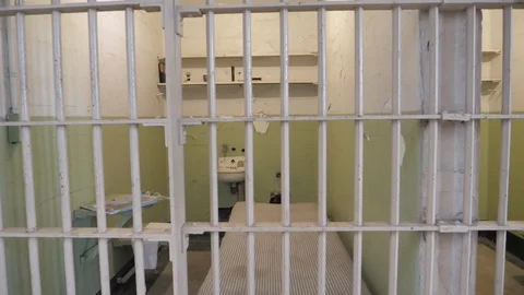 Jail Prison gaol cell bars imprisonment of guilty as criminal punishment B-roll Stock Footage 121653496