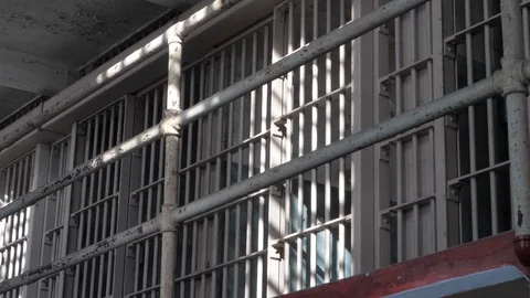 Jail Prison gaol cell bars imprisonment of guilty as criminal punishment B-roll Vidéo 121654904