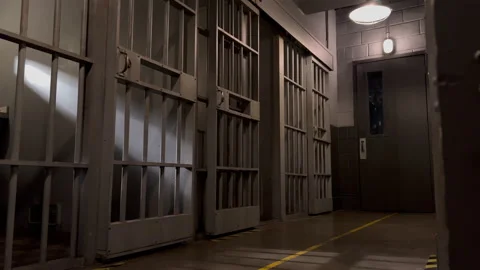 Jail prison hall cell bars dolly moody cinematic  Stock Footage 225235575