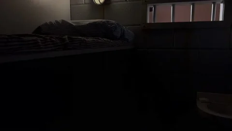 Jail proson cell pull out bars close Stock Footage 225298662