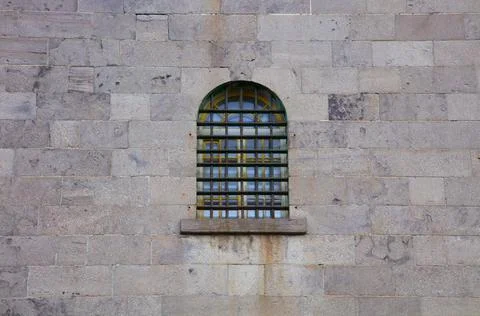 Jail window stone wall prison criminal incarceration crime lock Foto stock