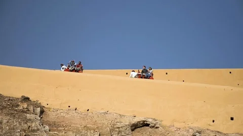 JAIPUR, India - tourists ride elephants up to the Amber Fort / Amer Fort Video stock 87576053