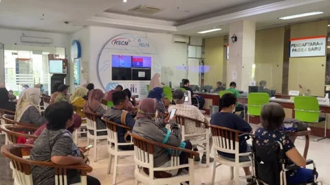 Jakarta, August 16, 2025. Patients sitting in the waiting area of a hospital reg Video stock 328341953