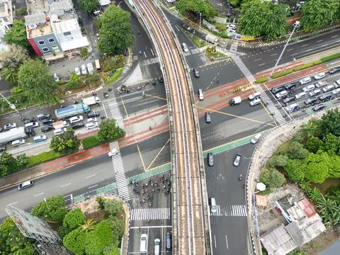 Jakarta Intersection with Elevated Train Tracks and Traffic, Aerial Drone Sho Stock Photos