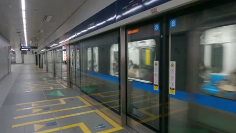 The Jakarta Mass Rapid Transit train stylized as MRT is moving at the station. Stock Footage 153790806