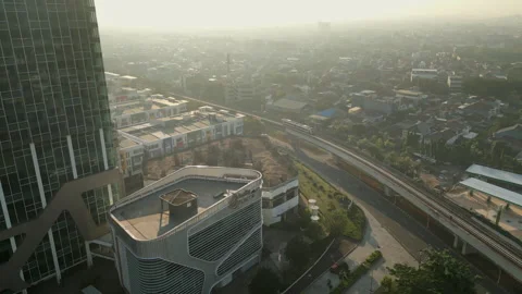 Jakarta MRT Train Curves Along Track Towards Kelapa Gading Early Morning Stock Footage 327692173