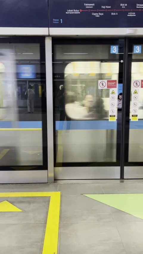 Jakarta MRT Train Leaving Underground Station Vertical Video Stock Footage 330637844