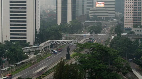 Jakarta Traffic Time Lapse 05 Jenderal Sudirman Statue Morning Stock-Footage 118082802