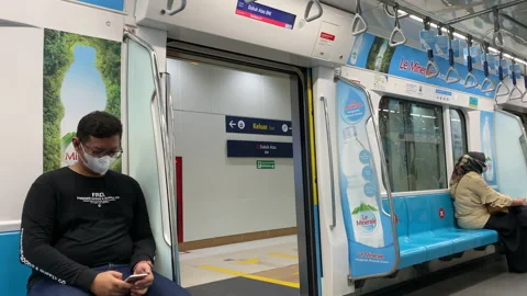 Jakarta's First MRT Closing Its Doors, Inside View, During Covid-19 Pandemic Stock Footage 156440099