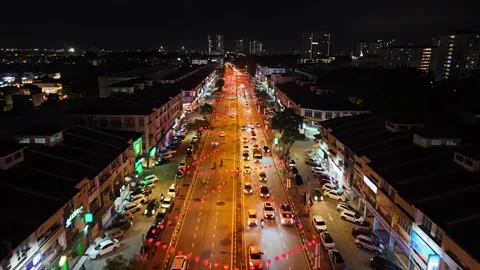 Jalan Raja Uda glows at night with rows of red lanterns 動画素材 327804265