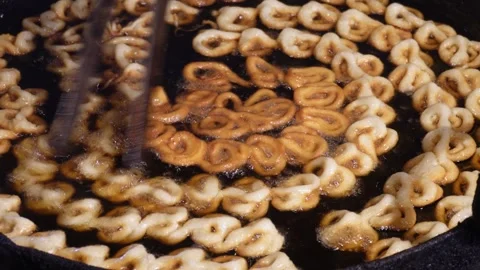 Jalebi being deep fried Stock Footage 328521096