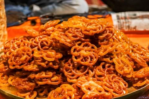 Jalebi is an Indian sweet and delicious food made of Maida flour and sugar syrup Stock Photos