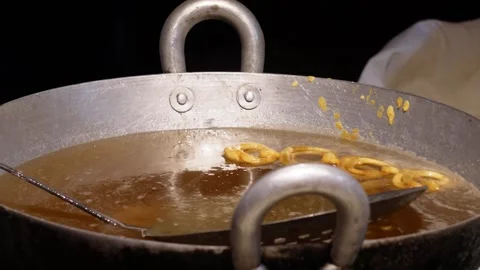 Jalebi Sinking in Dense Sugar Syrup Stock-Footage 326324291