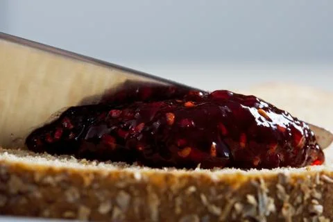 Jam and bread macro Stock Photos