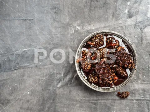 Jam with baby pine cones Stock Photos