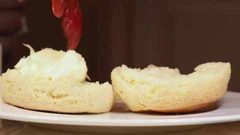 Jam Being Added To Clotted Cream On A Classic Scone, Afternoon Tea, UK Stock Footage 296038440