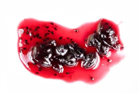 Jam cluster visuals. Closeup of currant jam with seeds and glossy appearance. De 库存照片