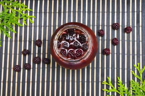Jam with a jam on a wooden background Stock Photos