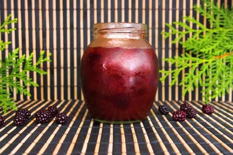 Jam with a jam on a wooden background Foto stock