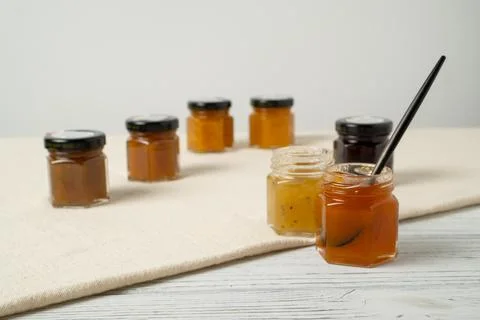 Jam jars as testing set. Holiday set of jam. Small marmalade glass jars. Jam  写真素材