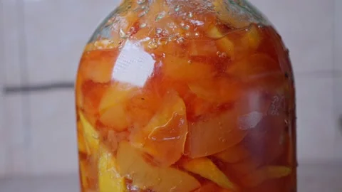 The jam is poured into a bottle Stock Footage 144663989