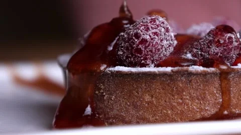 Jam pours for dessert raspberry Stock Footage 168341966