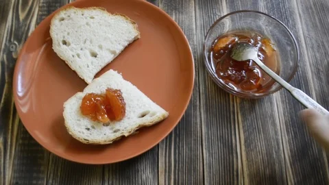 Jam spread on a piece of bread Stock Footage 96888908