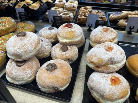 Jam on Sugar Dusted Donuts Stock Photos