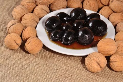 Jam from walnuts on a saucer Stock Photos