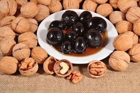 Jam from walnuts on a saucer Stock Photos