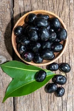 Jambolan plum, Java plum, Jambul( Syzygium cumini (L.) Skeels. on wooden ba.. Stock Photos