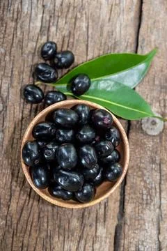 Jambolan plum, Java plum, Jambul( Syzygium cumini (L.) Skeels. on wooden ba.. Stock Photos