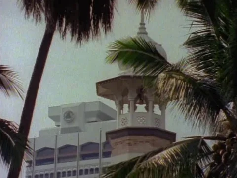 Jamek Mosque surrounded by coconut trees on a sunny day Video stock 79881311