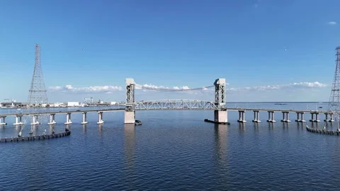 James River Lift Bridge Over Calm Water With Towers Under Clear Blue Sky Sunlit Stock-Footage 332948692