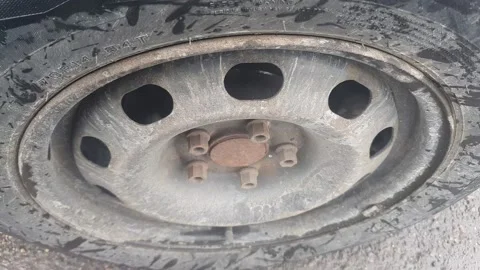 A jammed handbrake caused overheating of the disc brake pads, smoking car brakes Stock Footage 235565554