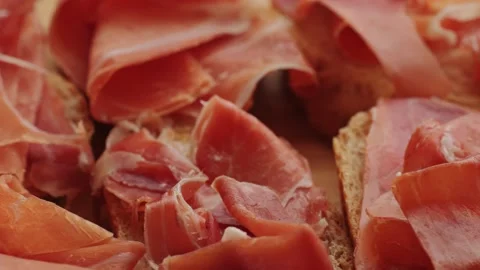 Jamon iberico tapas close up, chef cooking the best spanish ham pork tapas, cafe Stock Footage 233932120