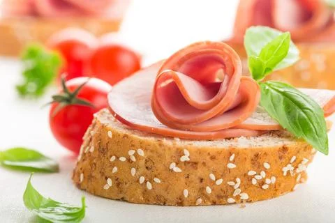 Jamon serrano isolated dish basil table slice Stock Photos