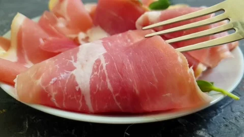 Jamon slice on old dark concrete background Stock Footage 170390211
