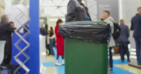 Janitor changing trash bag in public area during event Stock Footage 302277202