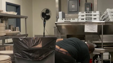 Janitor cleaning kitchen. 库存影片 76721571