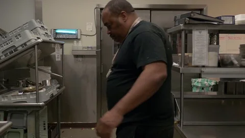 Janitor cleaning kitchen, medium shot. 스톡 동영상 76721644