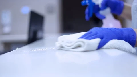 Janitor cleaning medical office counter top Stock Footage