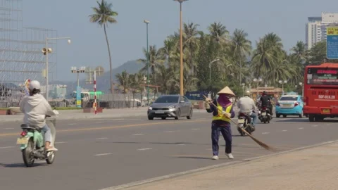 Janitor cleans the city from garbage using a big cart Vídeos de archivo 241493460