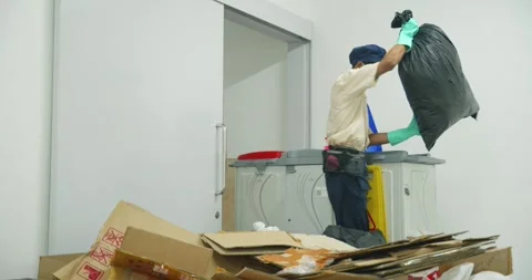 A janitor cleans up waste Stock Footage 304568831
