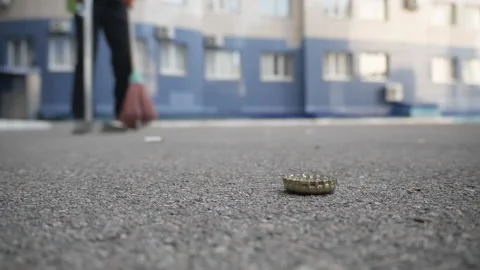 The janitor cleans the yard from garbage Stock Footage 156438684