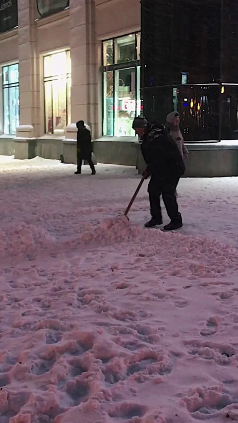 The janitor is clearing the snow Stock Footage 169859856