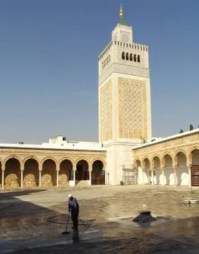 Janitor in the courtyard of the mosque Stock Photos