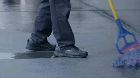 Janitor Mopping Sidewalk Outside Public Building Stock Footage 343960533