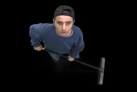 Janitor Sweeping--Looks Up Stock Footage 1042407