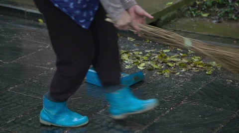 Janitor sweeps the street Stock Footage 49059802